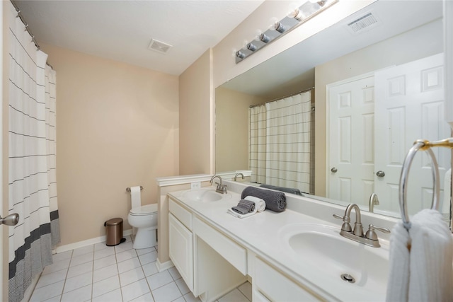 bathroom with visible vents, a sink, and tile patterned flooring
