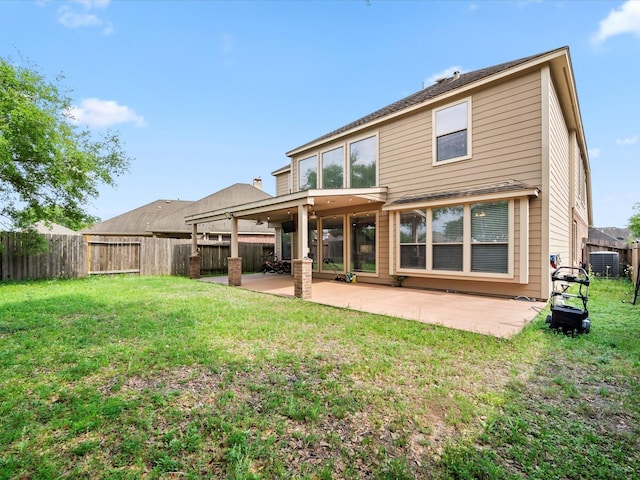 back of property with a lawn, a fenced backyard, a patio area, and cooling unit