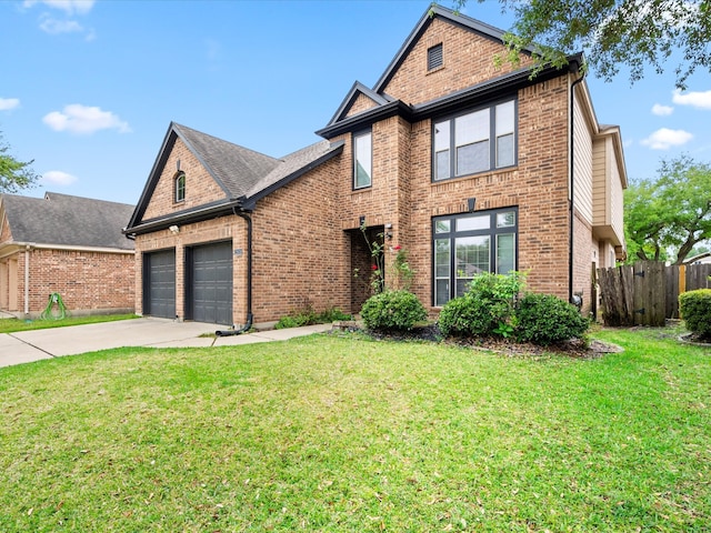 traditional home featuring a garage, brick siding, fence, a front lawn, and concrete driveway