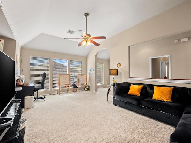 carpeted living room with ceiling fan, visible vents, arched walkways, vaulted ceiling, and baseboards