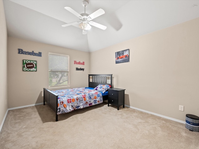 carpeted bedroom featuring baseboards, vaulted ceiling, and ceiling fan