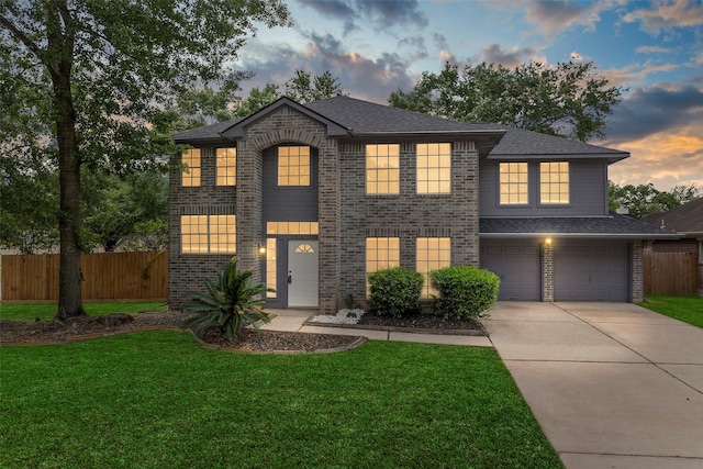 view of front of property featuring fence, an attached garage, concrete driveway, and brick siding