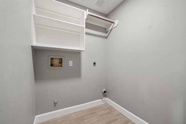 laundry room with laundry area, visible vents, baseboards, hookup for a washing machine, and hookup for a gas dryer