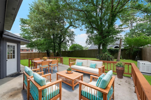 view of patio with a fenced backyard, outdoor dining space, and outdoor lounge area