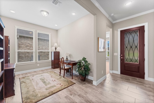 entryway with baseboards, ornamental molding, wood finish floors, and visible vents