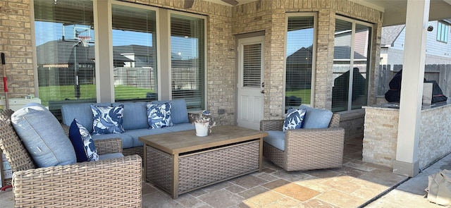 view of patio / terrace featuring fence and an outdoor hangout area