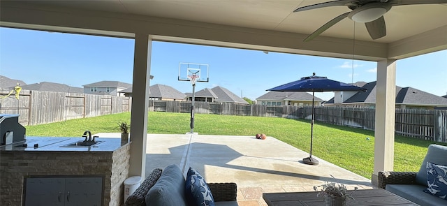 view of patio / terrace with a residential view, a ceiling fan, and a fenced backyard