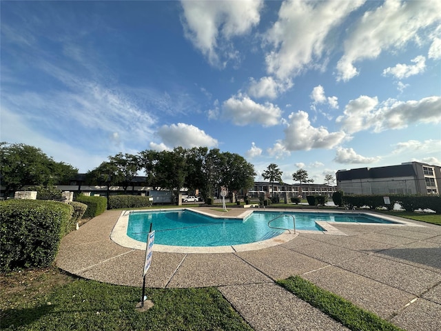 community pool featuring a patio area