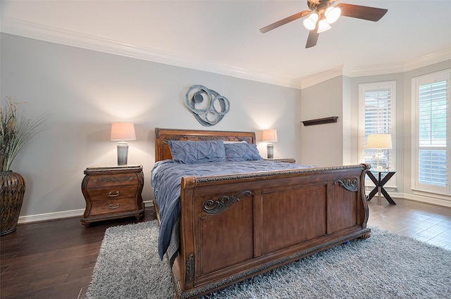 bedroom featuring dark wood-style floors, ornamental molding, baseboards, and a ceiling fan