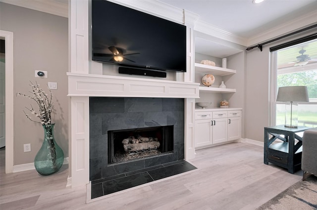 detailed view of ornamental molding, a fireplace, wood finished floors, baseboards, and recessed lighting