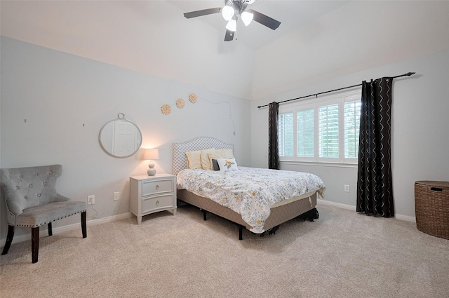 bedroom with light colored carpet, baseboards, vaulted ceiling, and ceiling fan