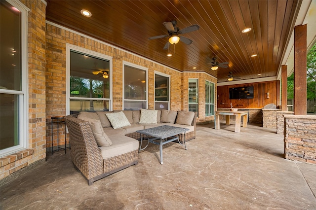 view of patio / terrace with exterior kitchen, ceiling fan, and an outdoor living space