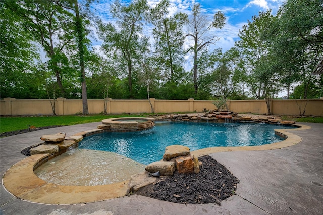 view of pool featuring a fenced backyard, a pool with connected hot tub, and a patio area