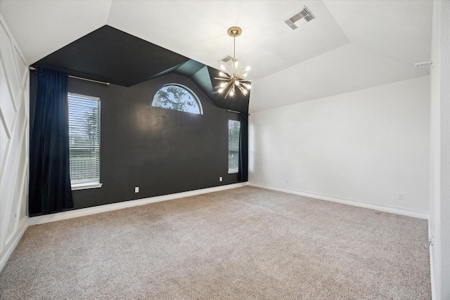 unfurnished room featuring carpet flooring, visible vents, an inviting chandelier, and vaulted ceiling