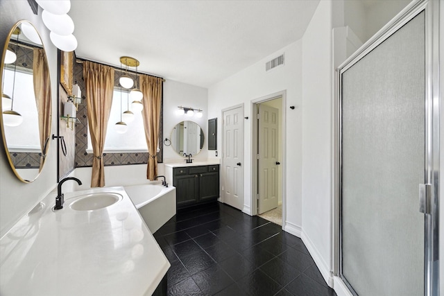 bathroom with visible vents, a sink, a bath, and a stall shower