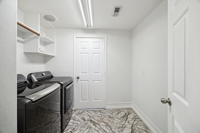 laundry area featuring laundry area, visible vents, marble finish floor, baseboards, and separate washer and dryer