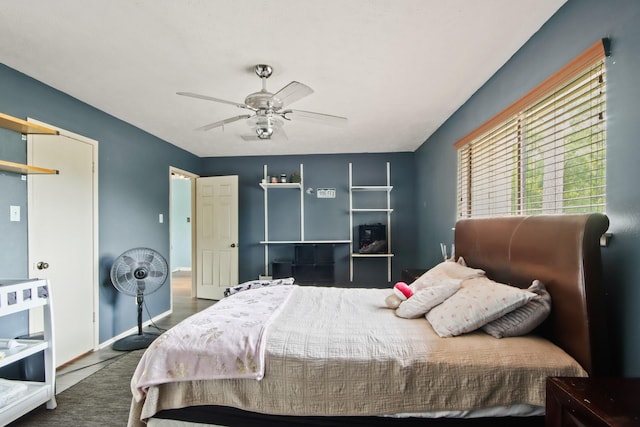 bedroom with ceiling fan and baseboards