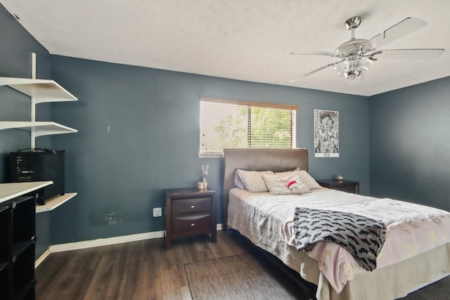 bedroom with baseboards, ceiling fan, and wood finished floors