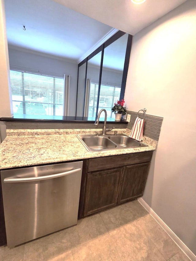 11711 Memorial Dr Unit 97, Houston, TX 77024 - kitchen featuring a sink, dishwasher, a healthy amount of sunlight, and dark brown cabinetry