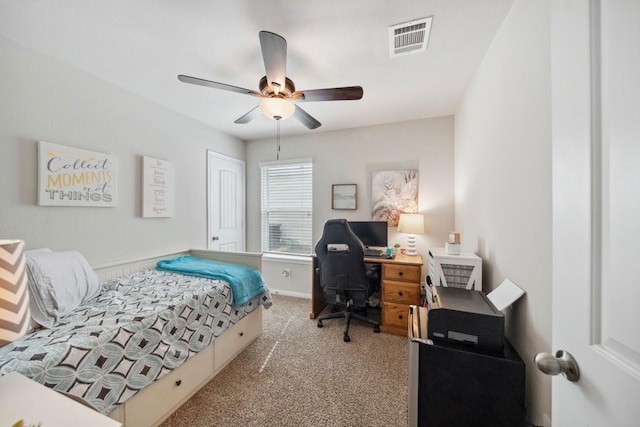 carpeted bedroom with visible vents, baseboards, and ceiling fan