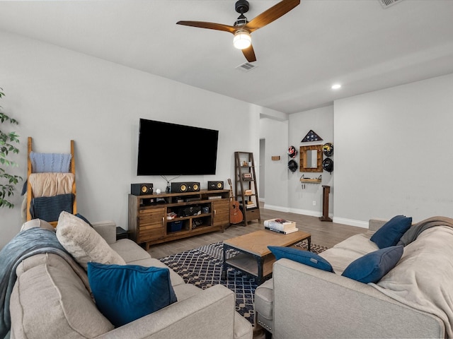 living area featuring ceiling fan, visible vents, wood finished floors, baseboards, and recessed lighting