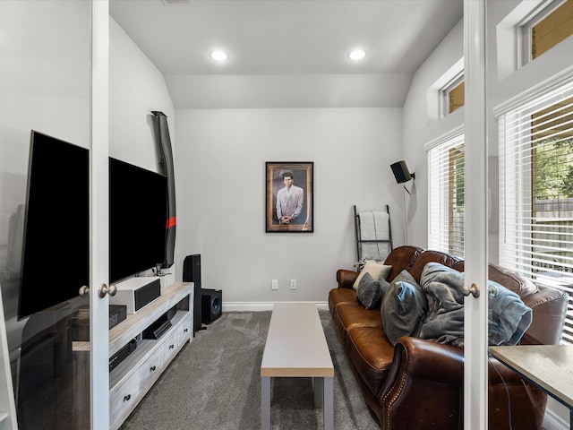 living room featuring baseboards, carpet flooring, vaulted ceiling, and french doors