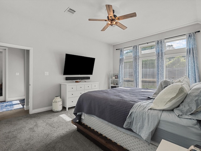 bedroom with baseboards, a ceiling fan, carpet flooring, and visible vents