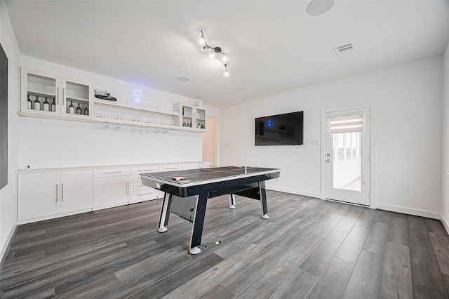playroom featuring baseboards, visible vents, and dark wood-style floors