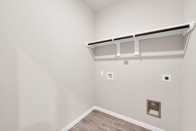 washroom featuring washer hookup, laundry area, gas dryer hookup, baseboards, and electric dryer hookup