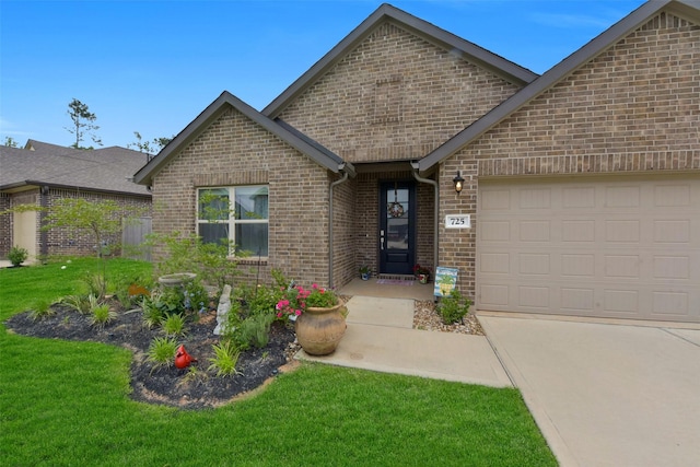 single story home featuring concrete driveway, brick siding, an attached garage, and a front lawn