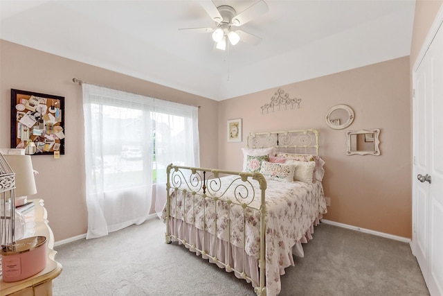 bedroom with baseboards, a ceiling fan, and carpet flooring