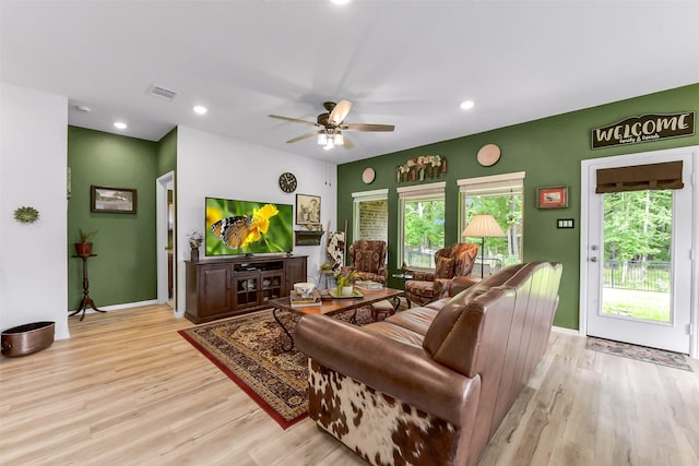 living room with a ceiling fan, baseboards, recessed lighting, light wood-type flooring, and visible vents