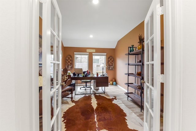 office space featuring wood finished floors, baseboards, recessed lighting, french doors, and vaulted ceiling