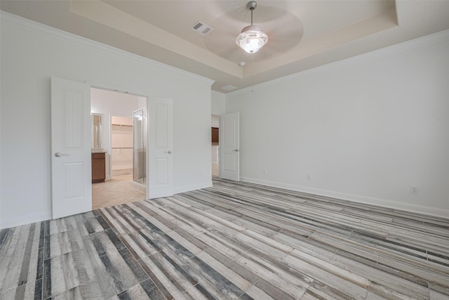 8135 W Pine Creek Bnd, Cypress, TX 77433 - unfurnished room featuring a tray ceiling, a ceiling fan, light wood-style flooring, crown molding, and baseboards