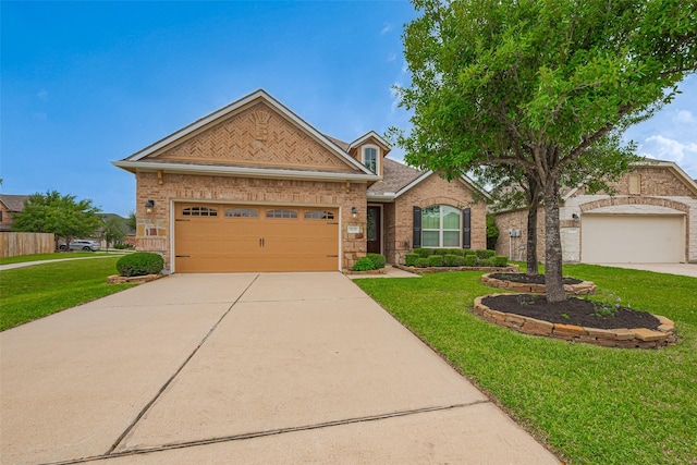 8135 W Pine Creek Bnd, Cypress, TX 77433 - view of front of home featuring a front yard, driveway, brick siding, and an attached garage