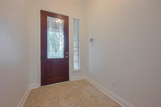 8135 W Pine Creek Bnd, Cypress, TX 77433 - foyer with baseboards and light tile patterned floors