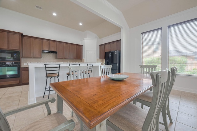 dining space featuring visible vents, crown molding, vaulted ceiling, light tile patterned floors, and recessed lighting
