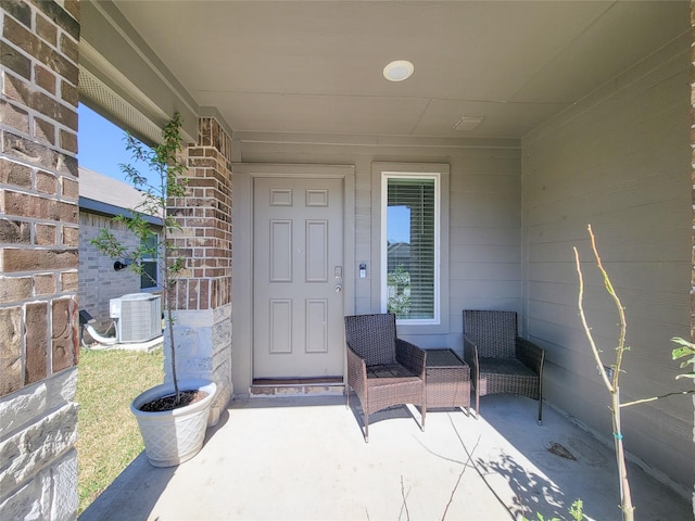 entrance to property featuring central AC and a patio area