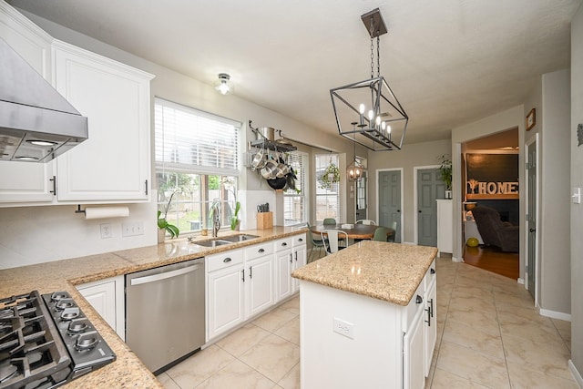 kitchen with custom exhaust hood, a center island, a chandelier, a sink, and dishwasher