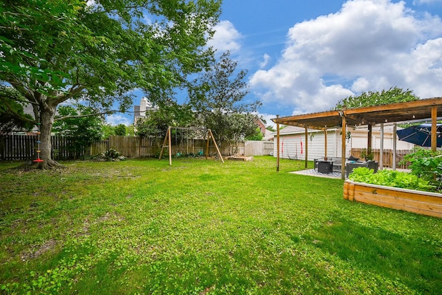 view of yard with a fenced backyard and a playground
