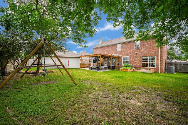 rear view of house with a yard, brick siding, a patio, and a fenced backyard
