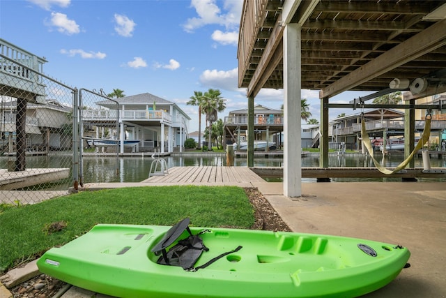 22118 Matagorda Dr, Galveston, TX 77554 - view of dock featuring a residential view, boat lift, and a water view