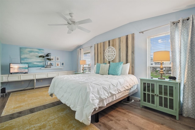 22118 Matagorda Dr, Galveston, TX 77554 - bedroom featuring multiple windows, wood finished floors, and lofted ceiling