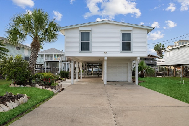 22118 Matagorda Dr, Galveston, TX 77554 - coastal inspired home with a carport, an attached garage, driveway, and a front lawn