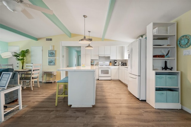 22118 Matagorda Dr, Galveston, TX 77554 - kitchen featuring visible vents, white appliances, a center island, white cabinets, and lofted ceiling with beams
