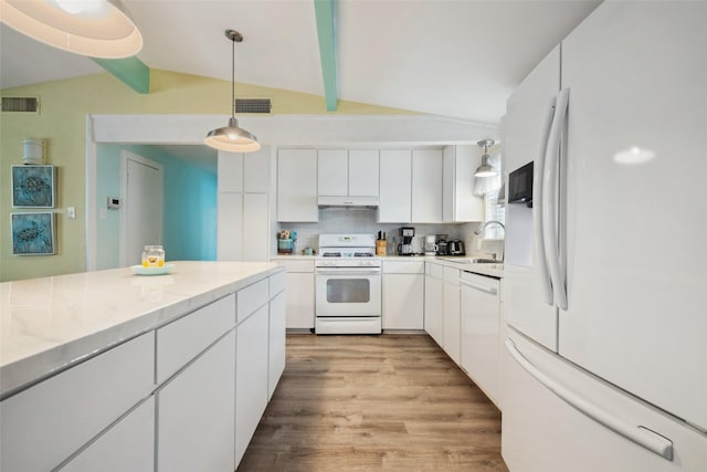 22118 Matagorda Dr, Galveston, TX 77554 - kitchen with white appliances, visible vents, and lofted ceiling with beams