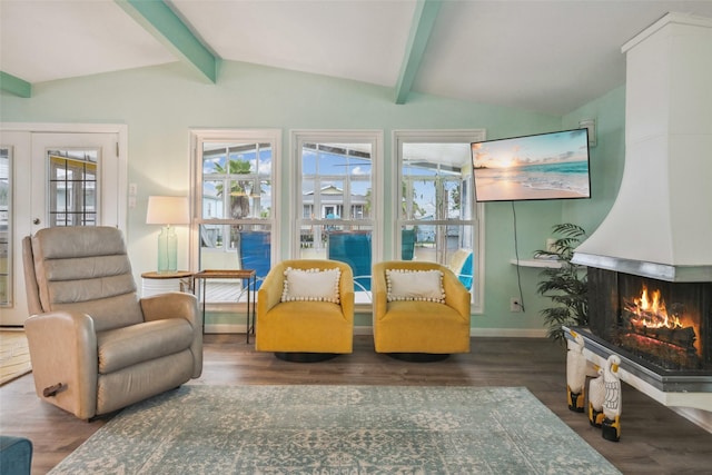 22118 Matagorda Dr, Galveston, TX 77554 - sitting room with lofted ceiling with beams, wood finished floors, and a wealth of natural light