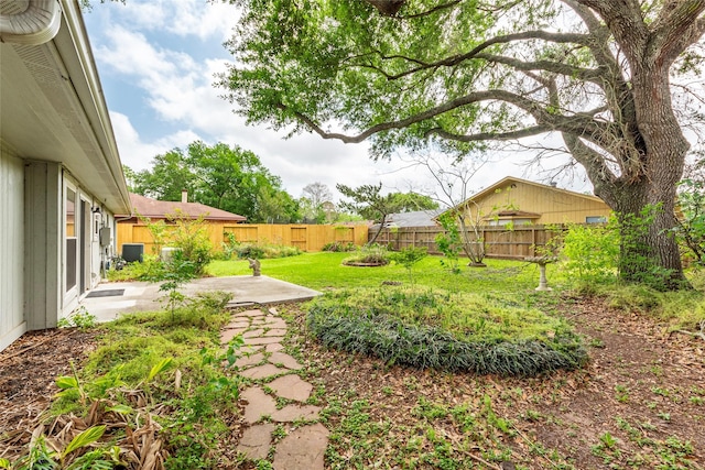 view of yard with a patio and a fenced backyard