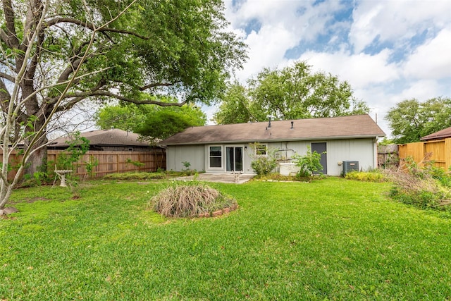 rear view of property with a lawn, a patio, fence, and cooling unit