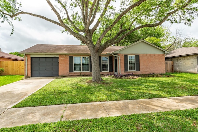 ranch-style home featuring brick siding, an attached garage, fence, and concrete driveway